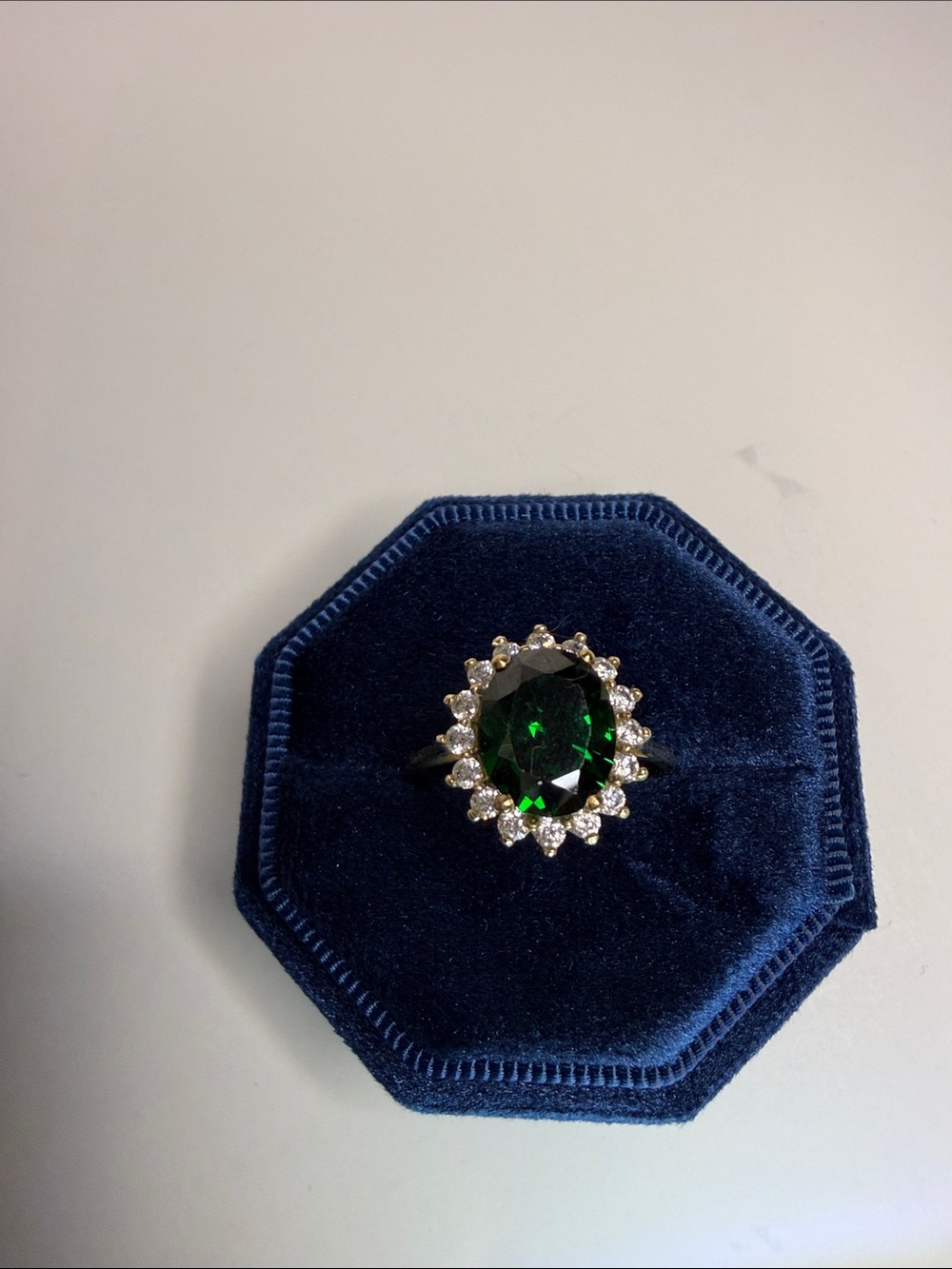 Lab grown emerald with moissanite halo stones in 14k